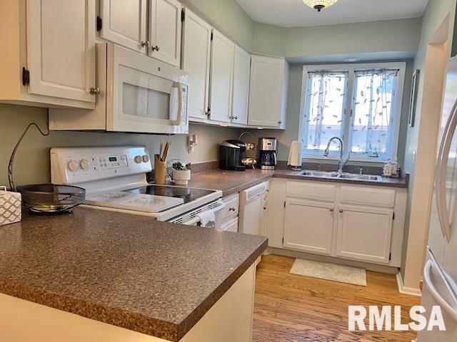 3550 Devils Glen Road Bettendorf, IA 52722 - Photo 5 of 30 a kitchen with granite countertop a sink stove and cabinets