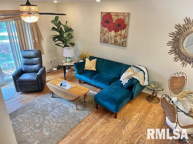 3550 Devils Glen Road Bettendorf, IA 52722 - Photo 10 of 30 a living room with furniture and a chandelier
