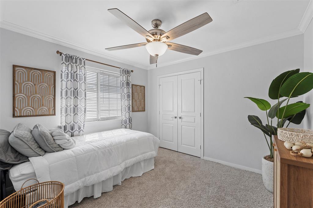 11209 Tree Lake Drive Waco, TX 76708 - Photo 23 of 40 a bedroom with bed couch and window