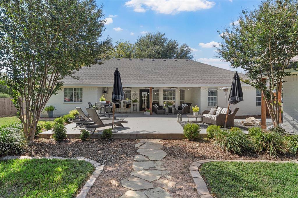 11209 Tree Lake Drive Waco, TX 76708 - Photo 26 of 40 a view of a house with backyard sitting area and garden