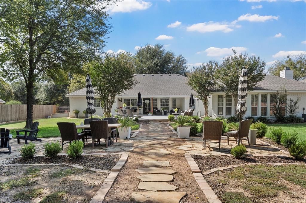 11209 Tree Lake Drive Waco, TX 76708 - Photo 29 of 40 a view of a house with backyard sitting area and garden