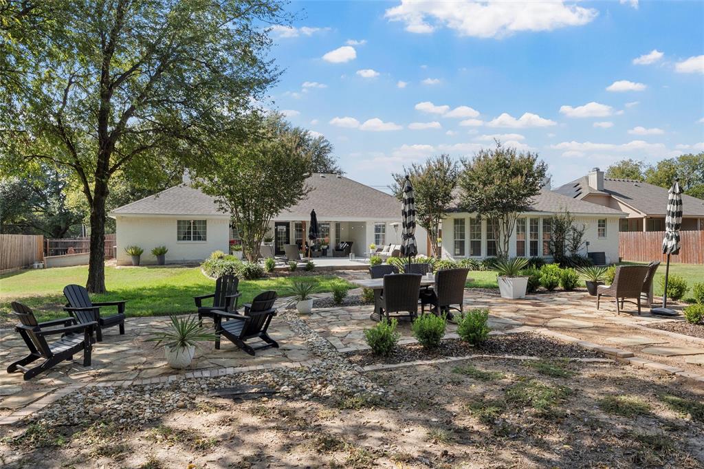11209 Tree Lake Drive Waco, TX 76708 - Photo 30 of 40 a front view of a house with garden and sitting area