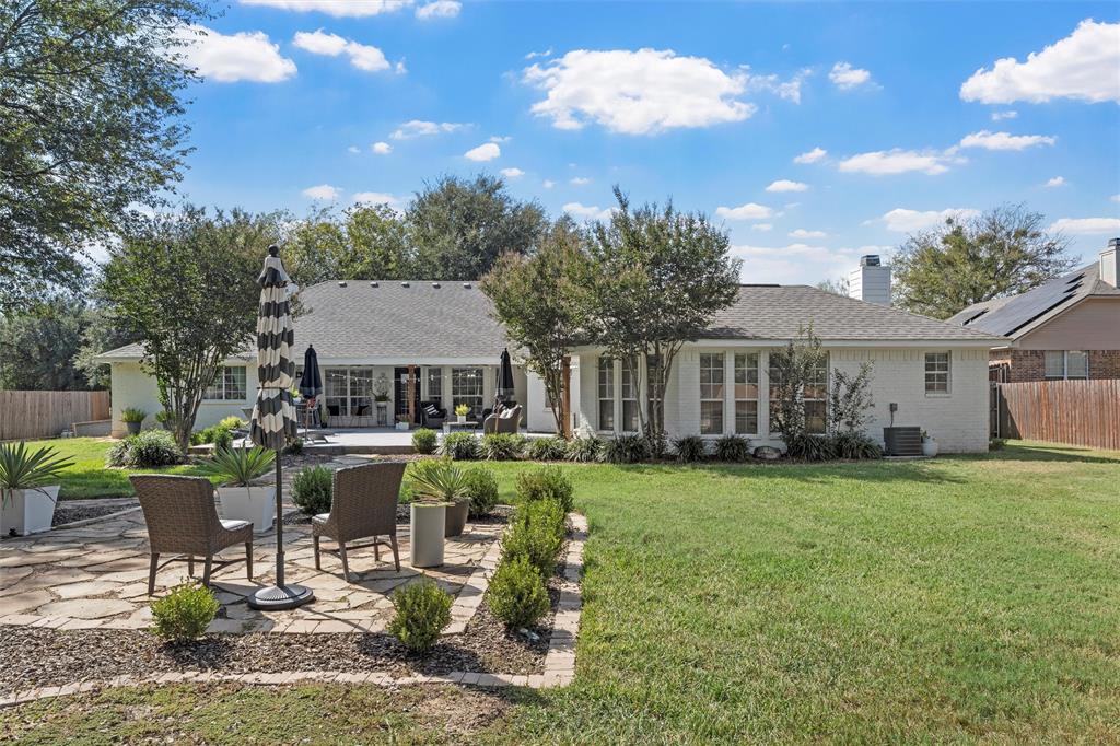 11209 Tree Lake Drive Waco, TX 76708 - Photo 32 of 40 a view of a house with backyard sitting area and garden