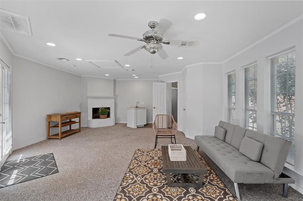 11209 Tree Lake Drive Waco, TX 76708 - Photo 34 of 40 a living room with furniture and a chandelier