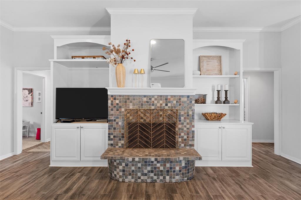 11209 Tree Lake Drive Waco, TX 76708 - Photo 8 of 40 a living room with furniture a flat screen tv and a fireplace