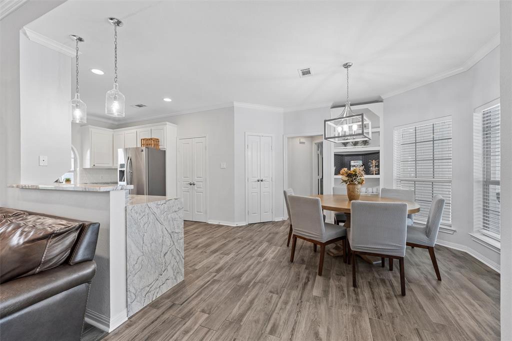 11209 Tree Lake Drive Waco, TX 76708 - Photo 9 of 40 a dining room with furniture and wooden floor