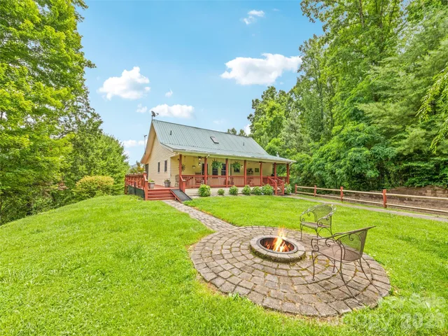 a view of a house with a yard porch and sitting area