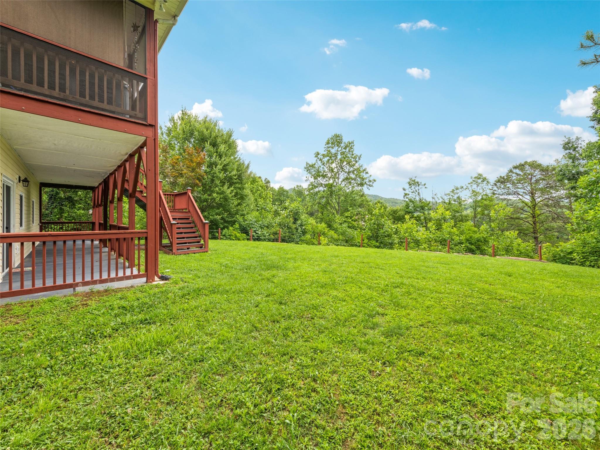 70 Lollis Lane Bryson City, NC 28713 - Photo 11 of 39 a view of a house with a backyard and a patio