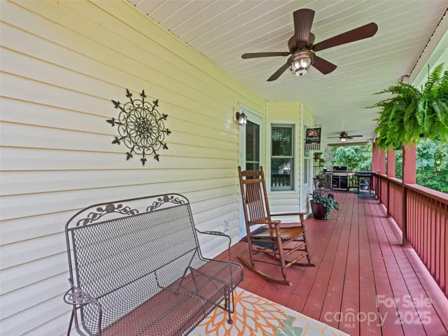 a view of a livingroom with furniture and hardwood floor