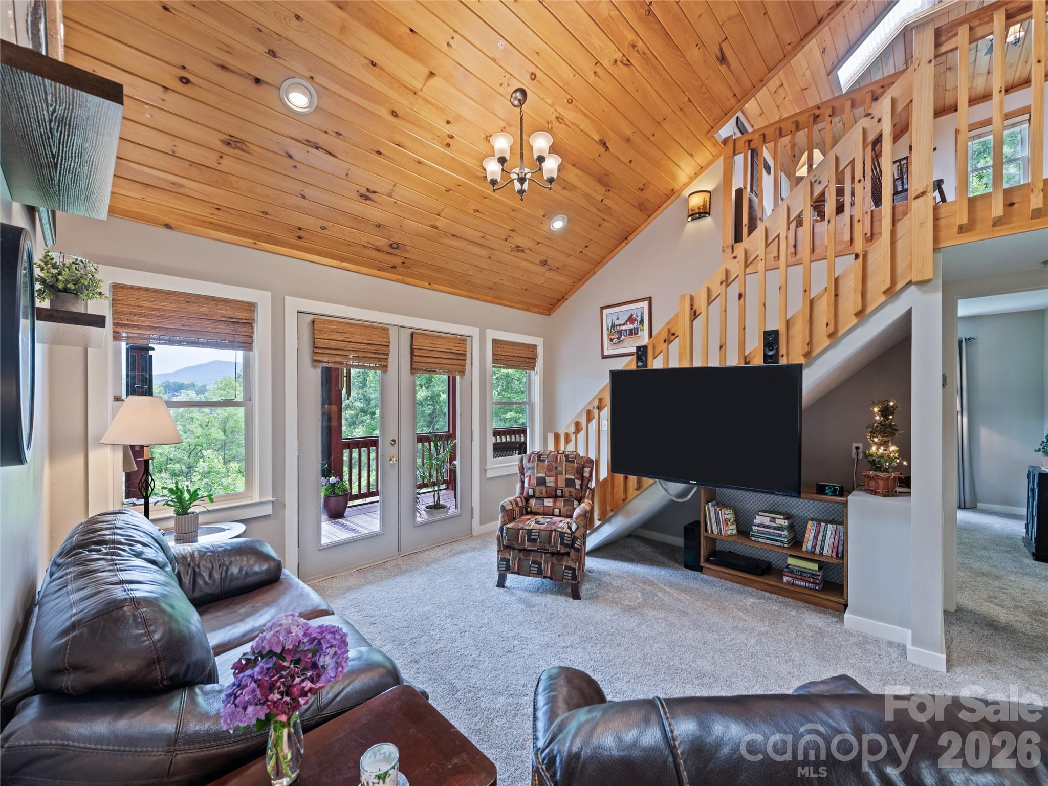 70 Lollis Lane Bryson City, NC 28713 - Photo 19 of 39 a living room with furniture and a flat screen tv