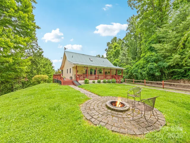 a view of a house with a yard porch and sitting area
