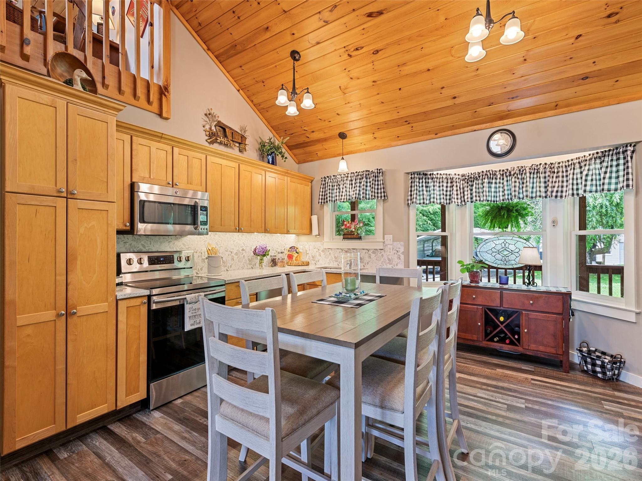70 Lollis Lane Bryson City, NC 28713 - Photo 22 of 39 a kitchen with a stove a sink and a refrigerator