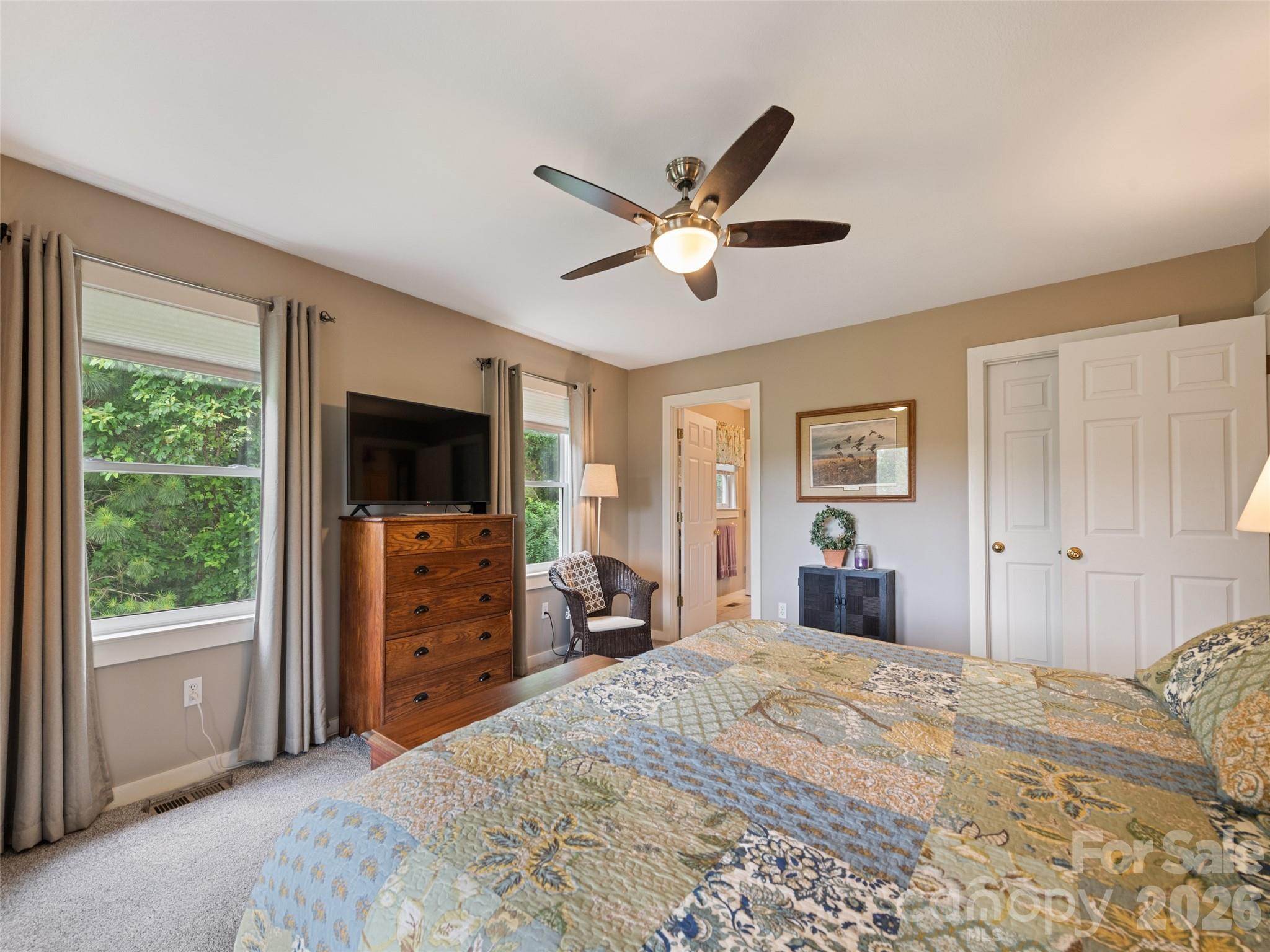 70 Lollis Lane Bryson City, NC 28713 - Photo 28 of 39 a bedroom with a bed and a flat screen tv