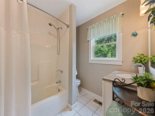 a bath room with a bath tub and a shower