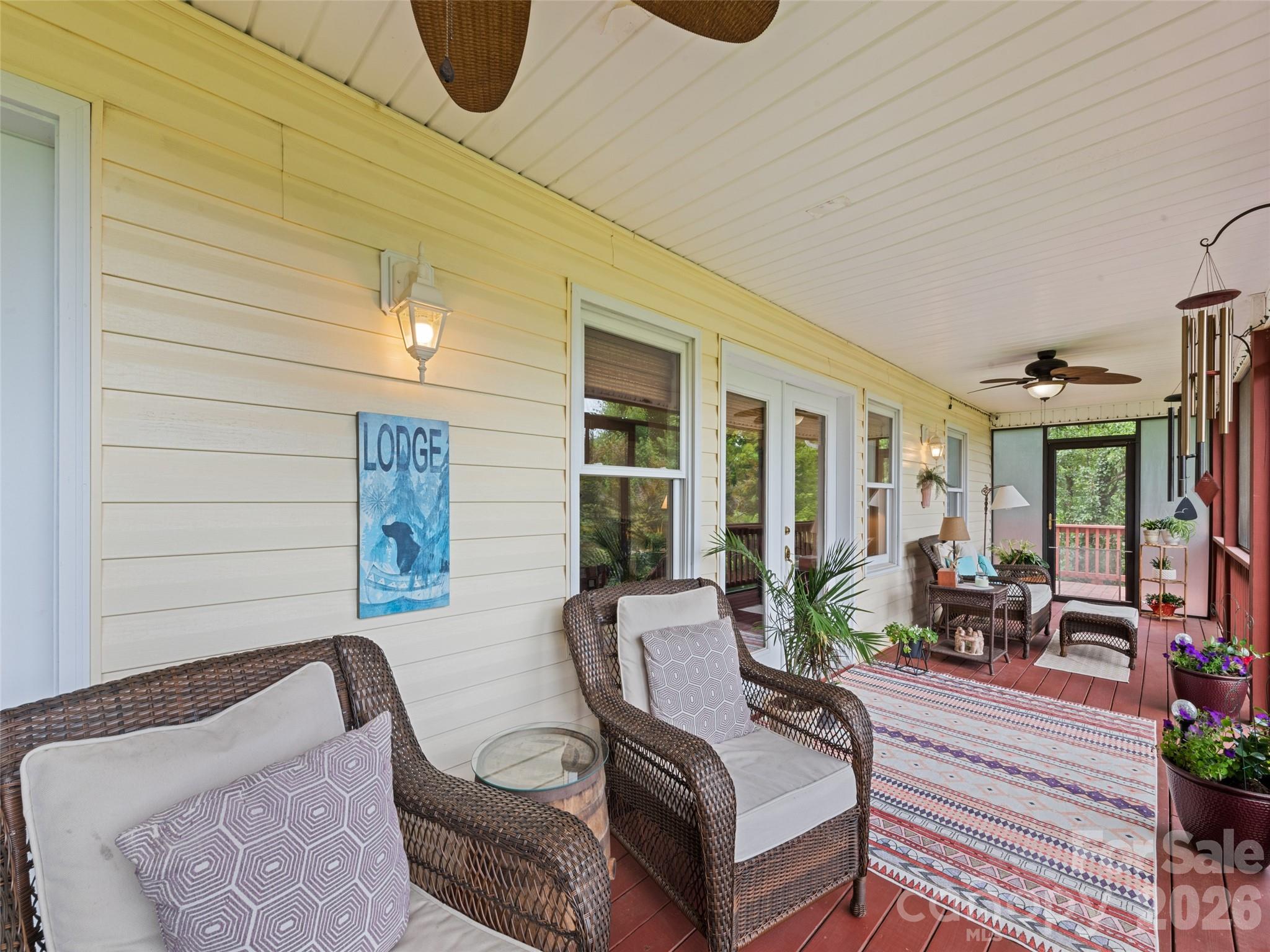 70 Lollis Lane Bryson City, NC 28713 - Photo 9 of 39 a building outdoor space with patio furniture and potted plants