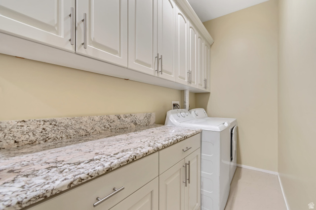 2543 East 700 South Springville, UT 84663 - Photo 48 of 73 Laundry room with cabinet space, washer and clothes dryer, and light tile patterned floors