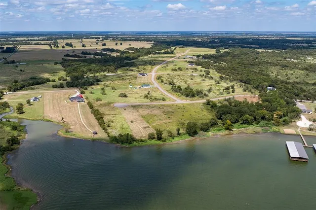 aerial view of a house with a yard