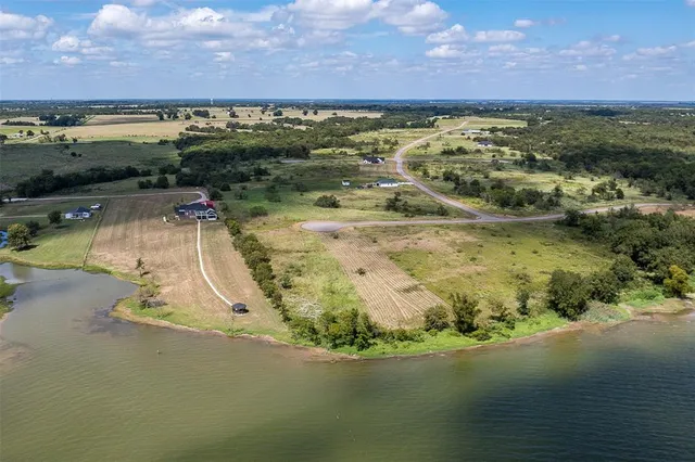 a view of an ocean beach and a yard