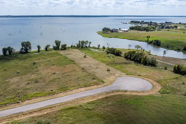 an aerial view of beach and yard