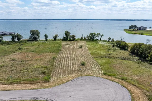 an aerial view of a house having swimming pool garden and sitting area