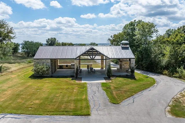 a view of a brick house with a large windows