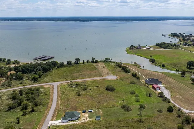 a view of a lake with a yard