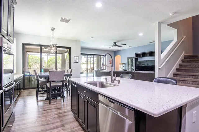 a spacious bedroom with a bed and a flat screen television