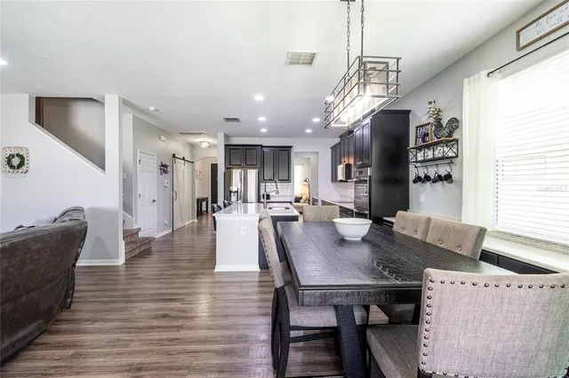 a living room with furniture a window and a table