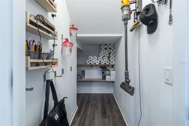 an aerial view of a house with a garden and lake view