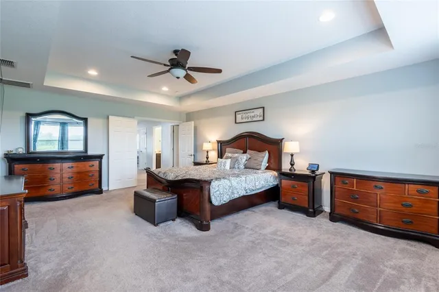 a front view of a house with a garden and yard