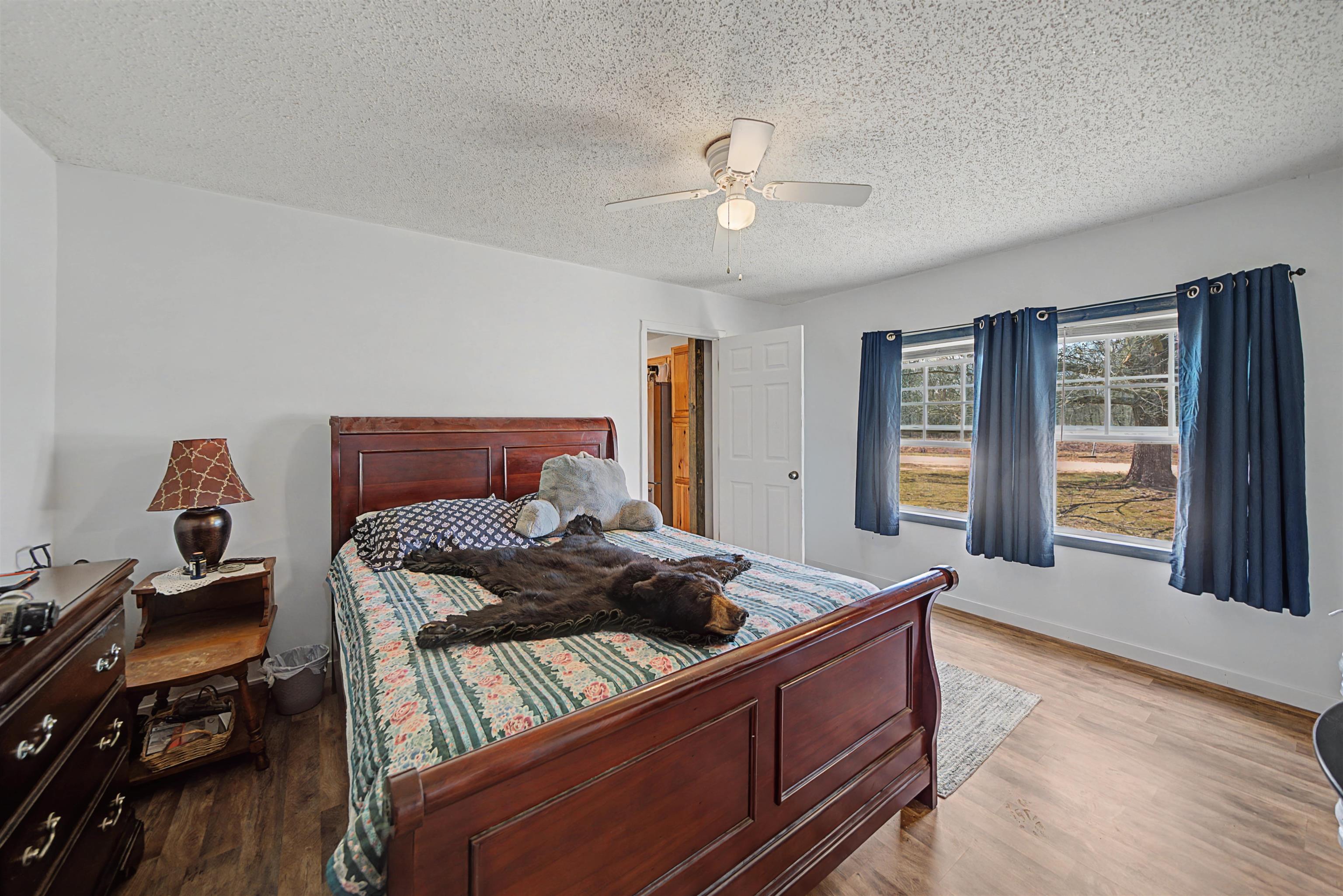 7010 22nd Highway Adamsville, TN 38310 - Photo 12 of 33 a bed room with bed and window