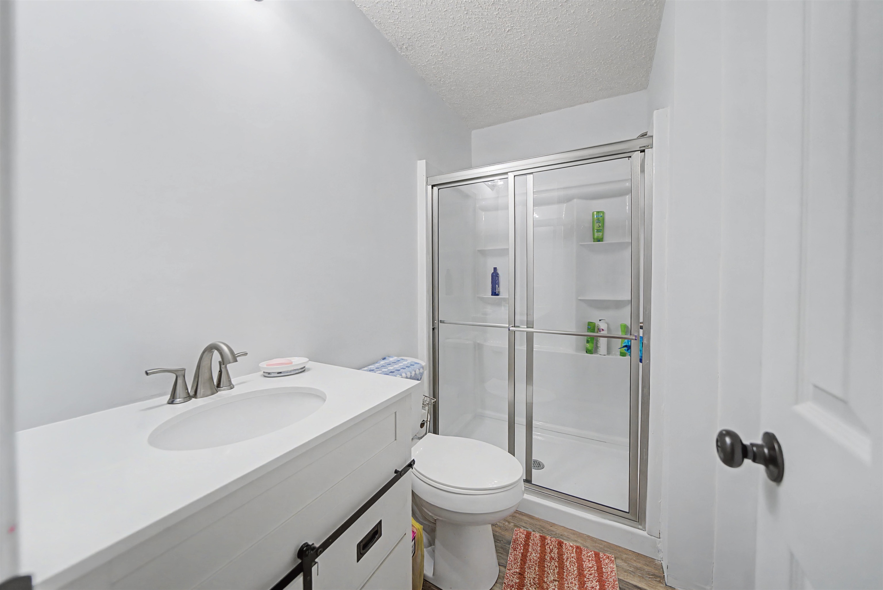 7010 22nd Highway Adamsville, TN 38310 - Photo 16 of 33 a bathroom with a sink toilet and shower