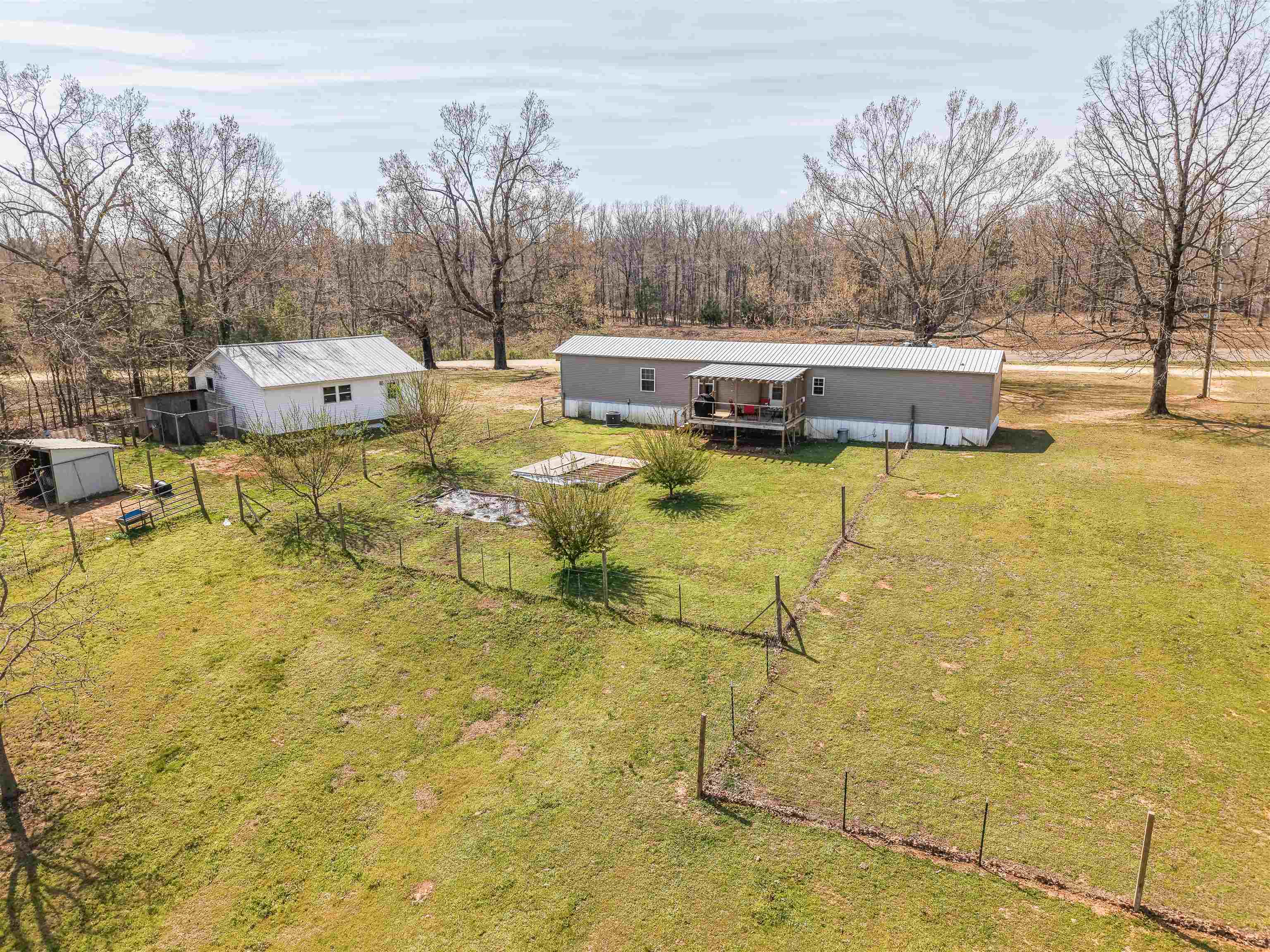 7010 22nd Highway Adamsville, TN 38310 - Photo 25 of 33 a swimming pool with outdoor seating and yard
