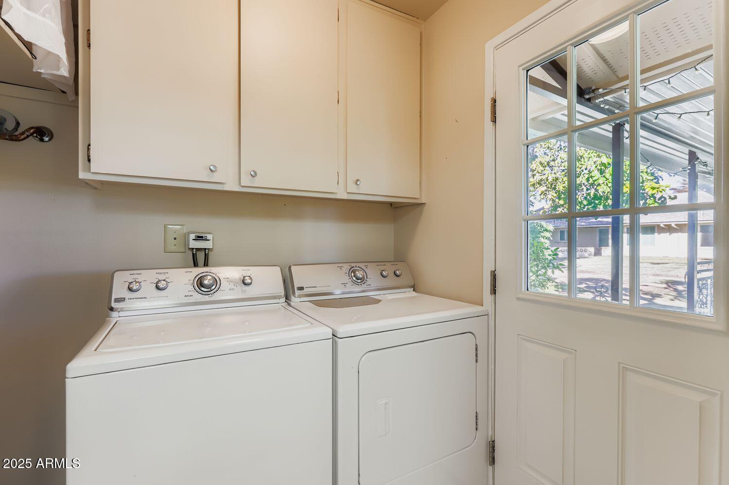 9524 West Greenway Road Sun City, AZ 85351 - Photo 22 of 25 a utility room with dryer and washer