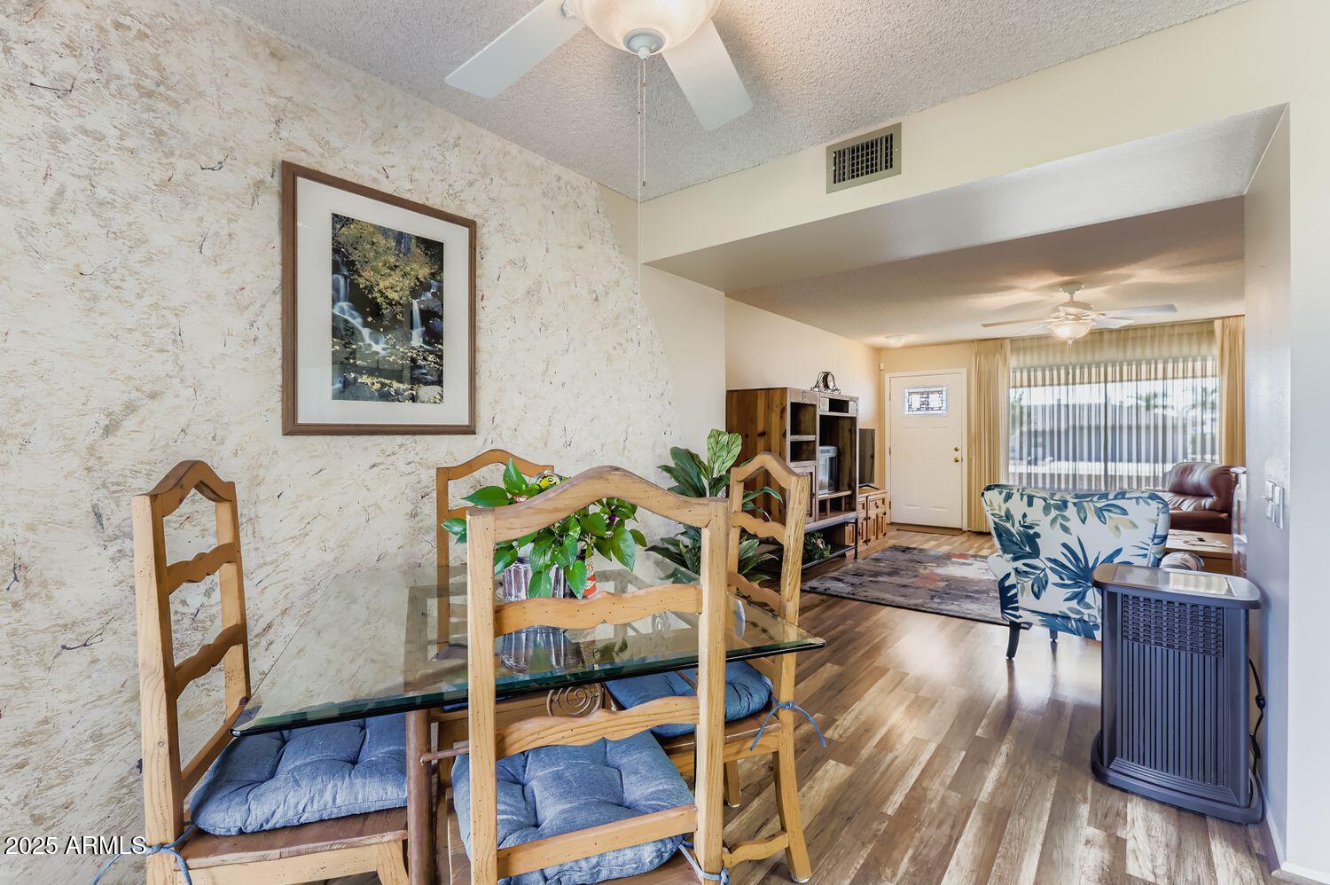 9524 West Greenway Road Sun City, AZ 85351 - Photo 4 of 25 a living room with furniture dining table and wooden floor