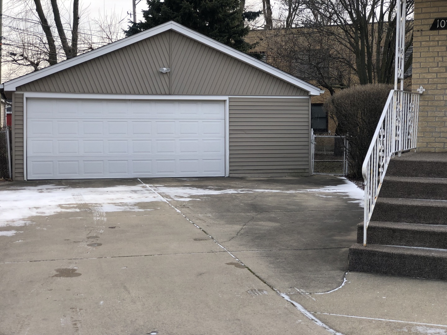 10733 South Harding Avenue Chicago, IL 60655 - Photo 3 of 20 a front view of a house with garage
