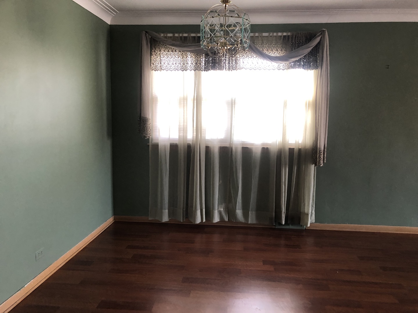 10733 South Harding Avenue Chicago, IL 60655 - Photo 6 of 20 a view of a room with wooden floor and a window