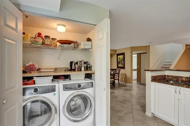 a view of a house with a small yard and plants