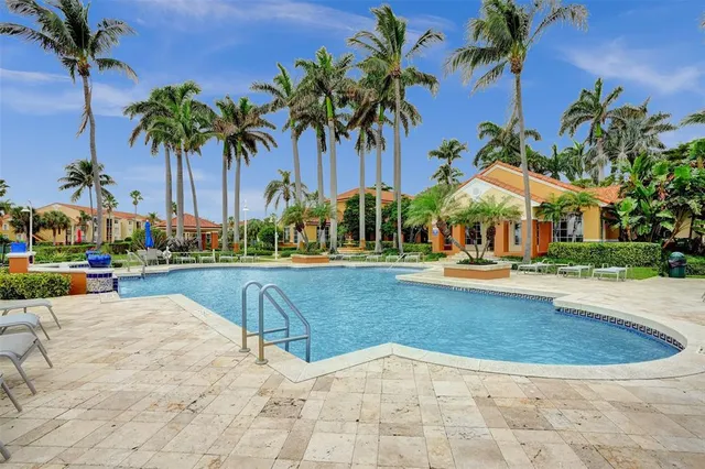 a view of swimming pool with a table and chairs