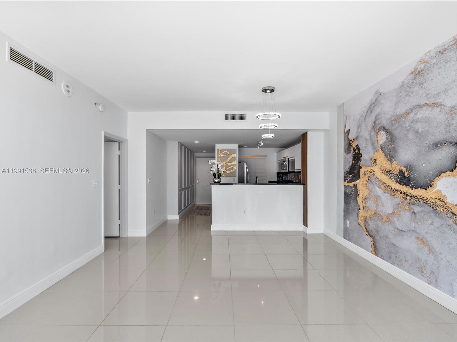 244 Biscayne Boulevard, Unit 1605 Miami, FL 33132 - Photo 13 of 46 a view of a living room hardwood and kitchen