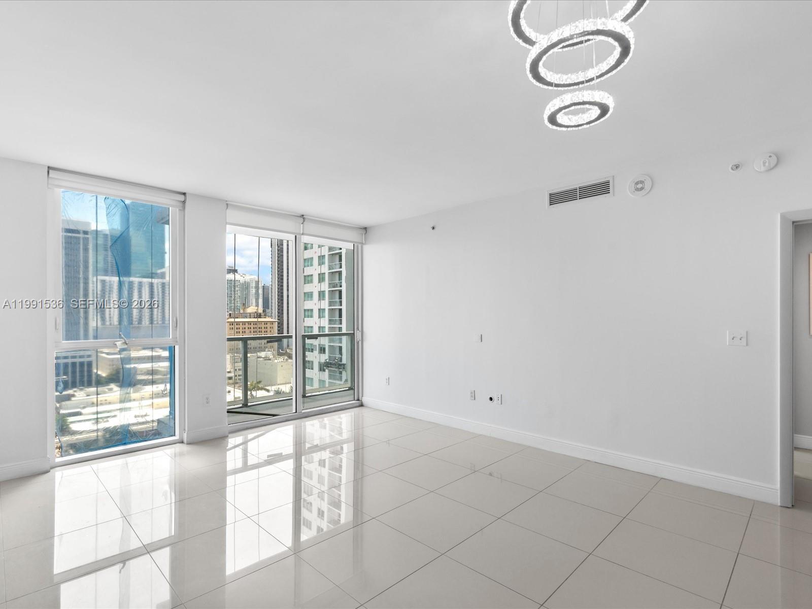 244 Biscayne Boulevard, Unit 1605 Miami, FL 33132 - Photo 15 of 46 a view of an empty room with a window