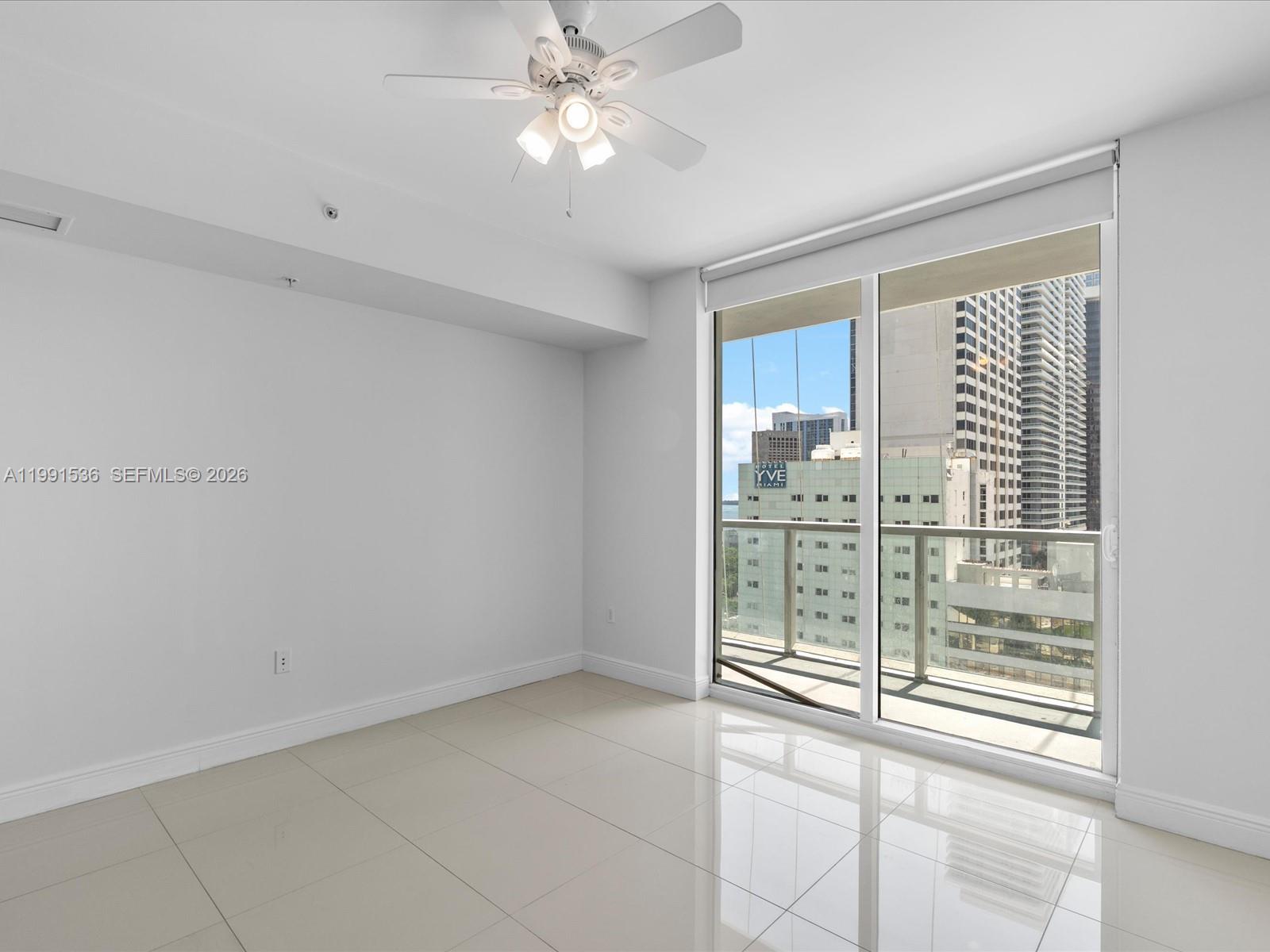 244 Biscayne Boulevard, Unit 1605 Miami, FL 33132 - Photo 19 of 46 a view of an empty room with a window