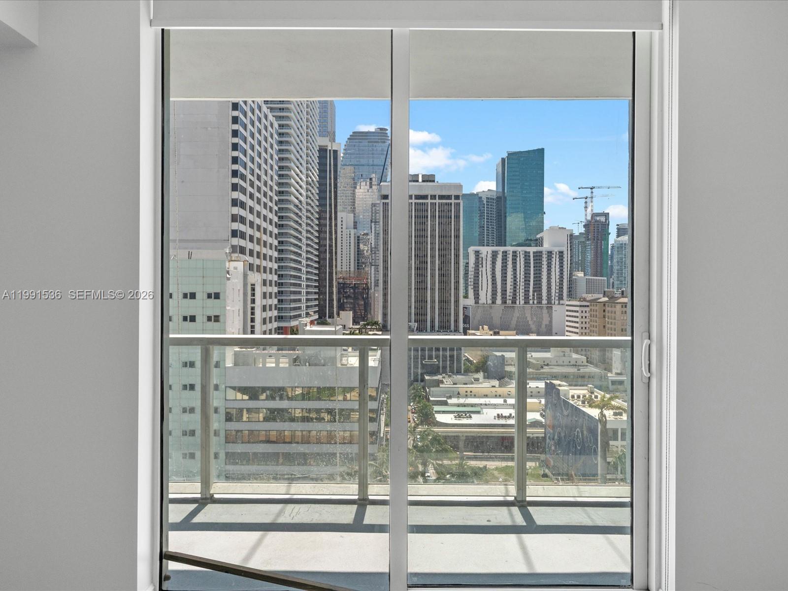 244 Biscayne Boulevard, Unit 1605 Miami, FL 33132 - Photo 23 of 46 a bathroom with a glass shower door