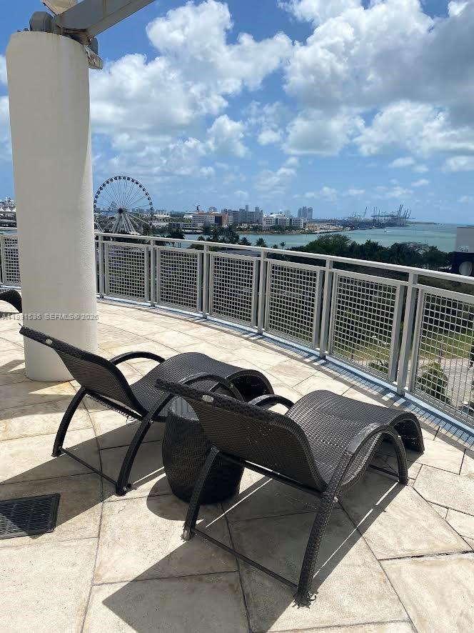 244 Biscayne Boulevard, Unit 1605 Miami, FL 33132 - Photo 36 of 46 a view of a roof deck with couches and sky view