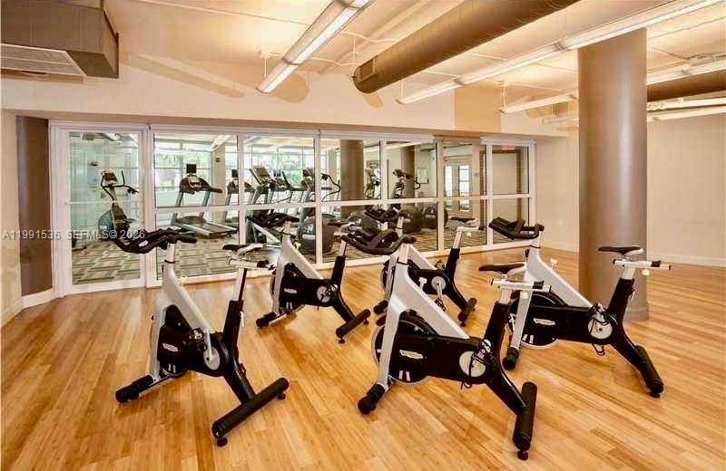 244 Biscayne Boulevard, Unit 1605 Miami, FL 33132 - Photo 37 of 46 a view of a room with gym equipment