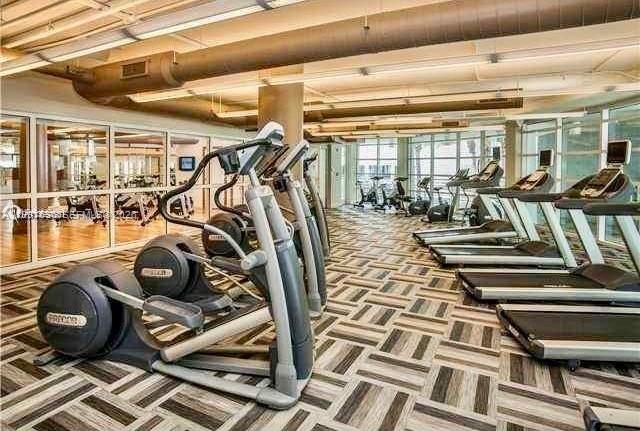 244 Biscayne Boulevard, Unit 1605 Miami, FL 33132 - Photo 38 of 46 a view of a room with gym equipment