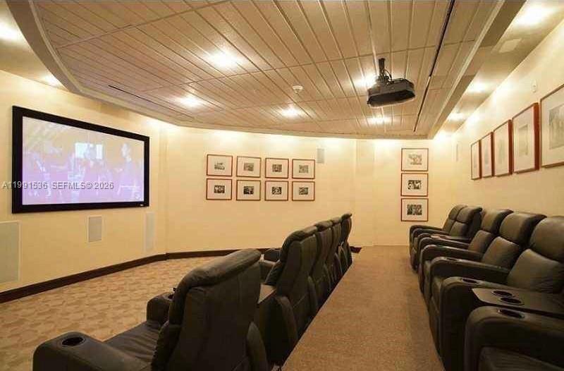 244 Biscayne Boulevard, Unit 1605 Miami, FL 33132 - Photo 44 of 46 a living room with furniture and a flat screen tv