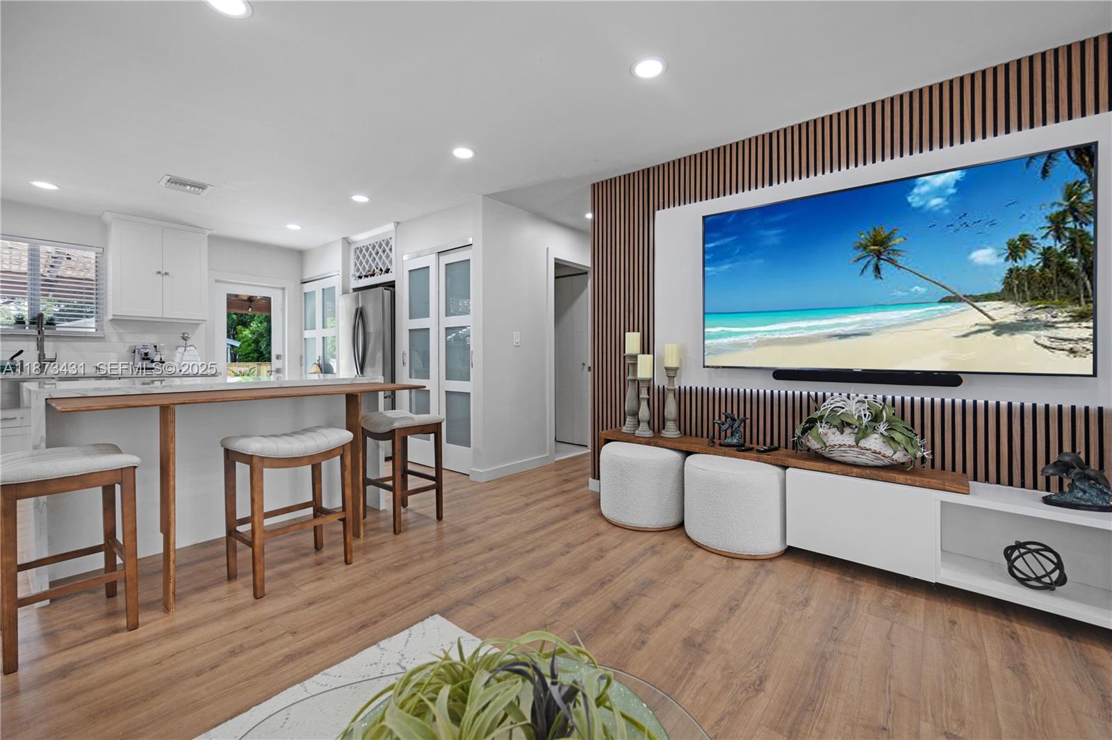 53 Bonefish Avenue Key Largo, FL 33037 - Photo 20 of 25 a living room with furniture a flat screen tv and a wooden floor