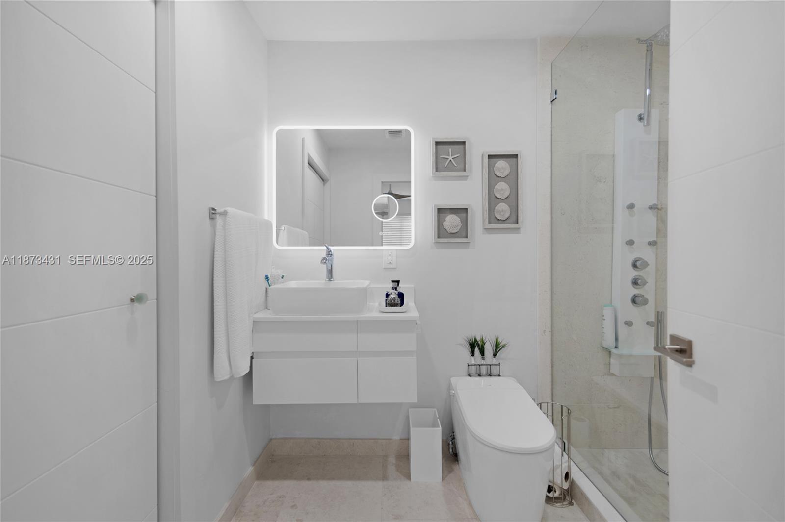 53 Bonefish Avenue Key Largo, FL 33037 - Photo 24 of 25 a bathroom with a sink a toilet and shower