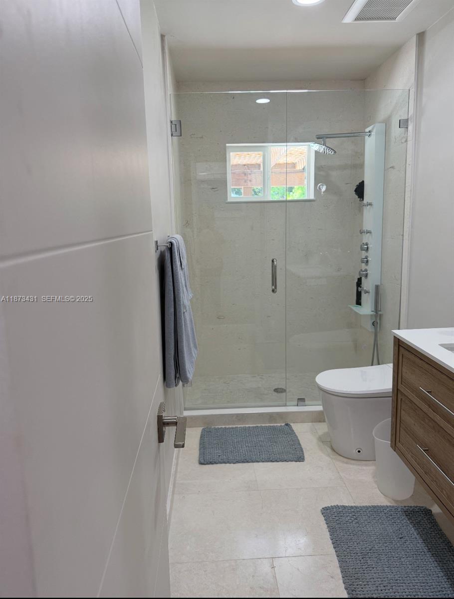 53 Bonefish Avenue Key Largo, FL 33037 - Photo 25 of 25 a bathroom with a toilet and a shower
